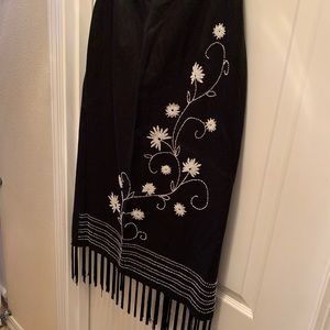 Straight black skirt with beading and fringe.